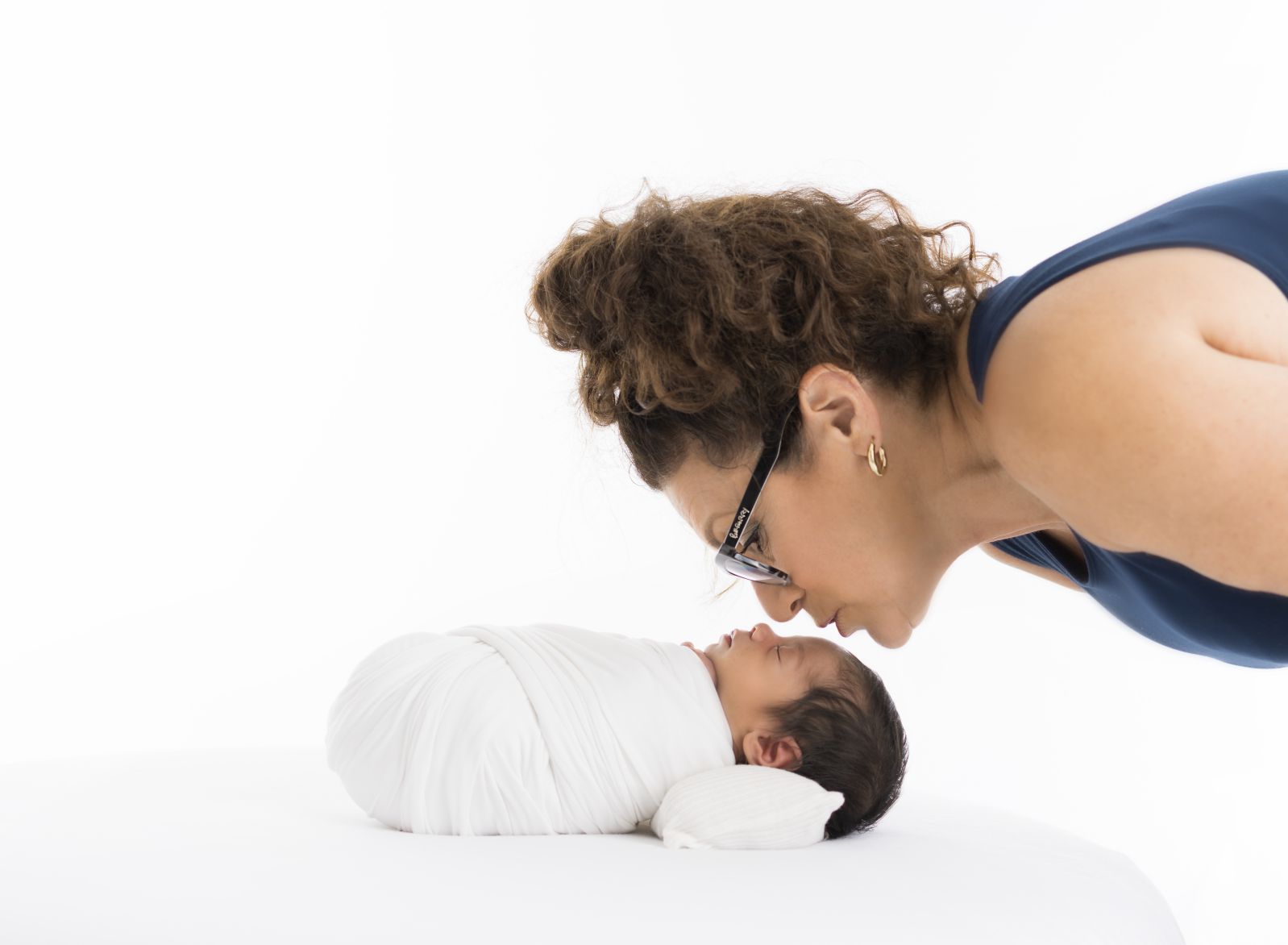 modern newborn photoshoot mom over baby blog