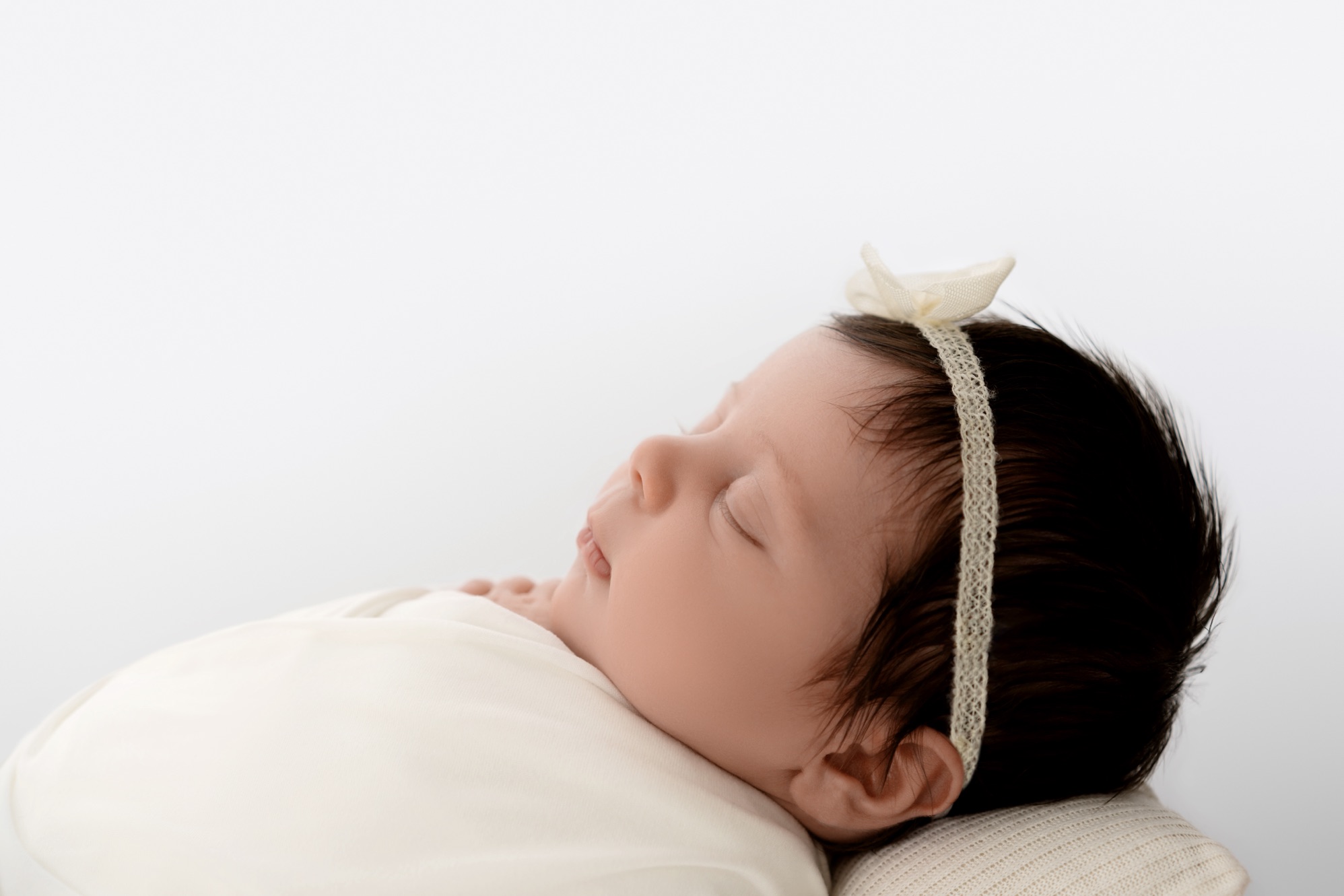 upscale newborn session side view home page